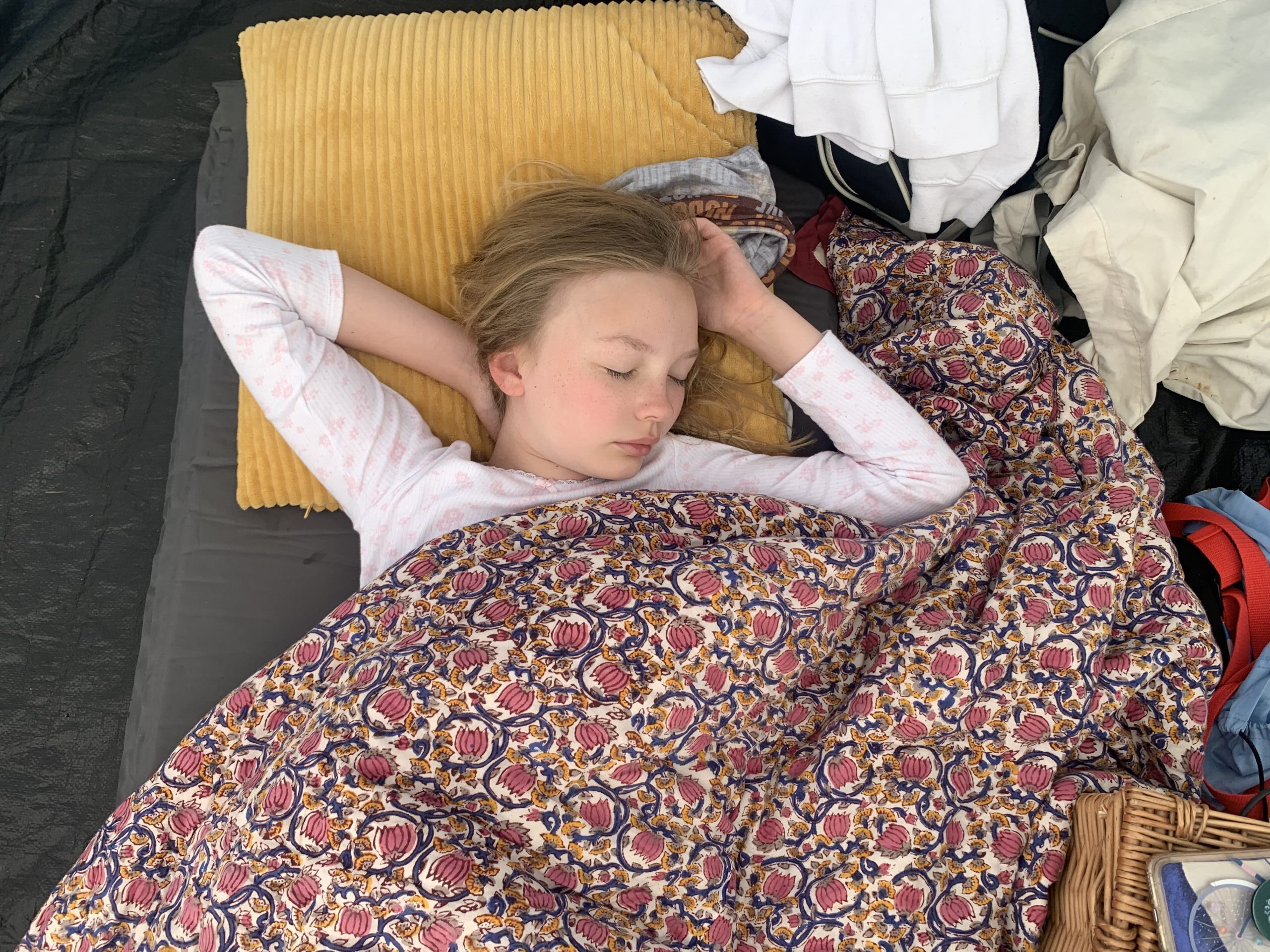 Child fast asleep in a tent